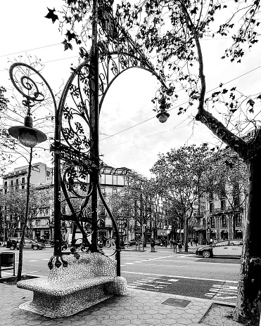 The Bancs-Fanals (bench-lanterns) are located along Passeig de Gràcia in Barcelona. Created in 1906 by the then municipal architect Pere Falqués i Urpí (1850-1916), they are one of his most famous works, although they have sometimes been attributed to the modernist architect Antoni Gaudí. These thirty-two benches are constructed with the classic \