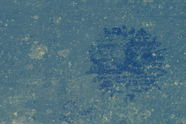 istock Light blue background abstract texture with dark-blue and grey granules and patches. 1492361797