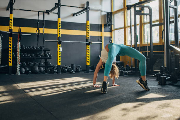 istock Fit woman exercising in gym 1492362444