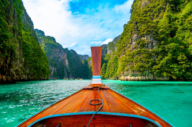 istock View of Pi Leh lagoon (also known as Green Lagoon) at Ko Phi Phi islands, Thailand. View from typical long tailed boat. Typical Thai picture of tropical paradise. Limestone rock and turquoise water. 1492362838