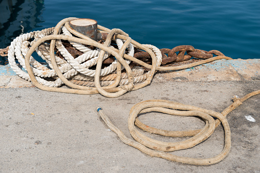Anchored in Tradition: Exploring the Rustic Beauty of a Fishing Port's Mooring Bollards