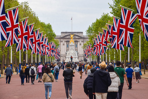 London, UK - May 21 2023: Union Jacks line The Mall leading to Buckingham Palace ahead of Trooping The Colour.