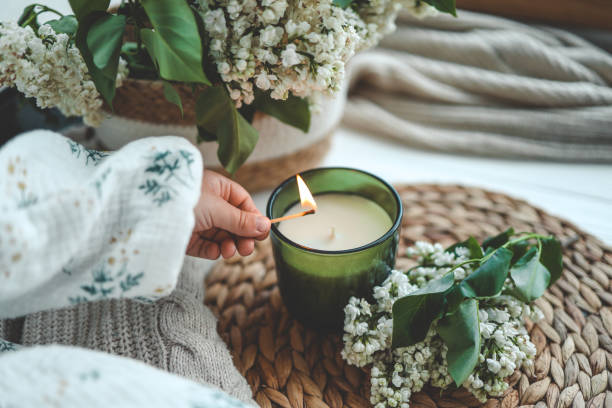 istock Match in hand lighting candles, aesthetics 1492366192