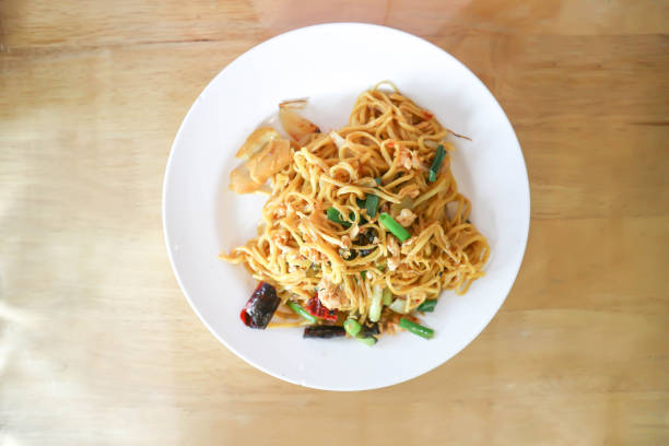 A plate of stir fried seafood udon noodle