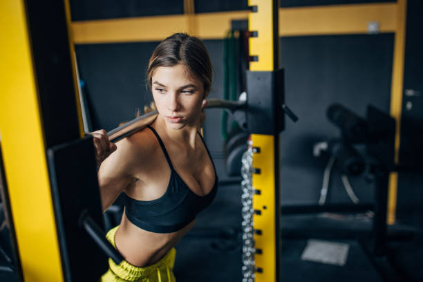 Young woman exercising in gym