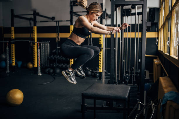 istock Fit woman jumping in gym 1492366502
