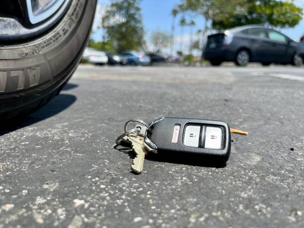 istock Keys on the ground in a parking lot 1492369452
