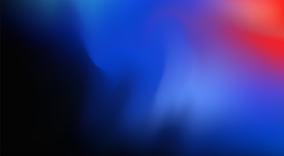 Blurry defocused colourful gradient abstract background on dark