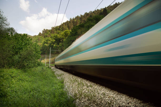istock Bullet train is speeding trough nature background 1492371734