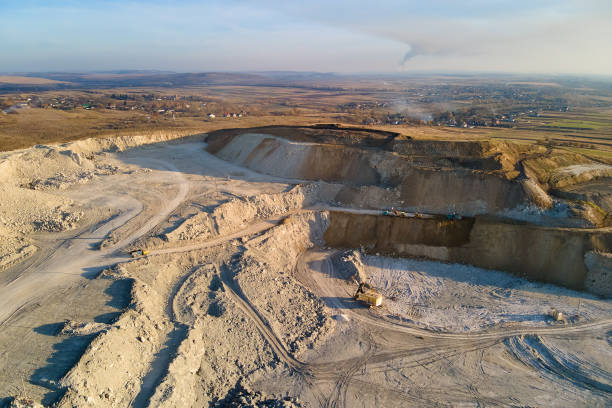 istock Aerial view of open pit mining site of limestone materials for construction industry with excavators and dump trucks 1492372388