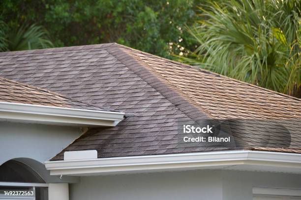 Closeup Of House Roof Top Covered With Asphalt Or Bitumen Shingles Waterproofing Of New Building Stock Photo - Download Image Now