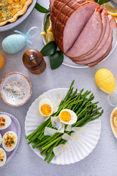 istock Asparagus cooked on a plate topped with parmesan 1492373803