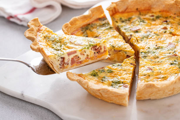 istock Homemade quiche with ham and cheese cut on the table 1492373950