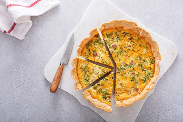 istock Homemade quiche with ham and cheese cut on the table 1492373977