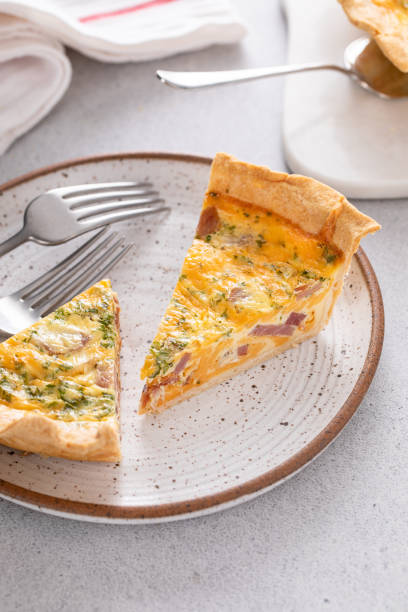 istock Homemade quiche with ham and cheese cut on the table 1492373981