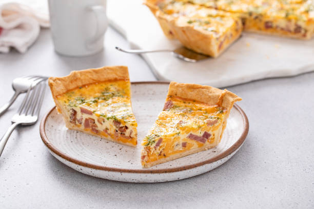 istock Homemade quiche with ham and cheese cut on the table 1492373987