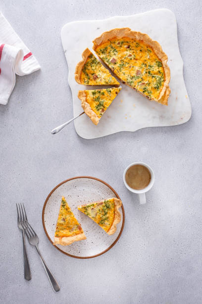 istock Homemade quiche with ham and cheese cut on the table 1492373995