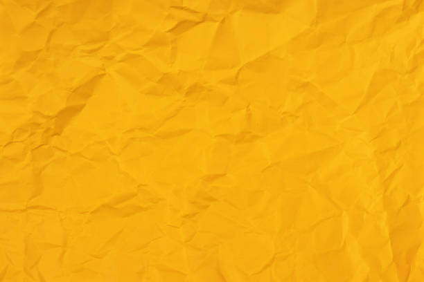 istock Clean yellow paper, wrinkled, abstract background. 1492374495