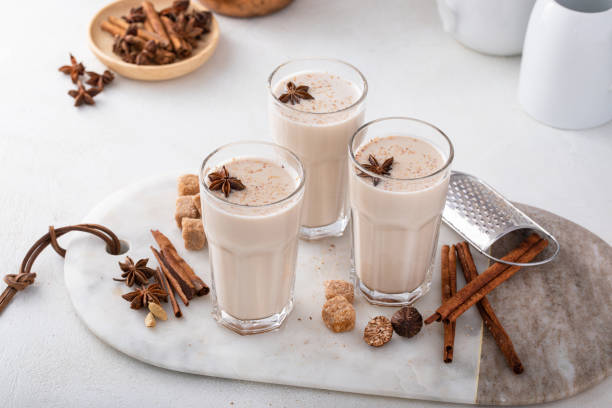 istock Homemade chai in tall glasses with spices on a board 1492374975