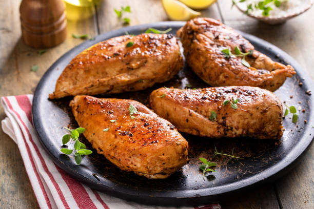 istock Grilled or roasted chicken breast on a serving plate 1492375024