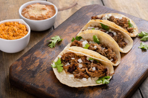 istock Pork carnitas tacos on a cutting board 1492375055