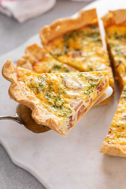 istock Homemade quiche with ham and cheese cut on the table 1492375095