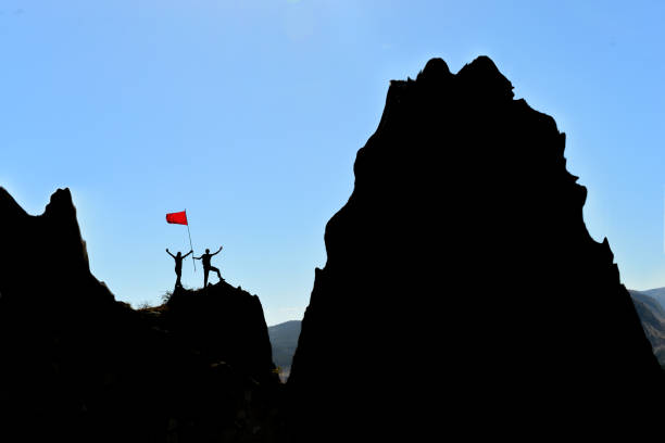 istock Victory memory of two mountaineers on the jagged cliffs 1492376733