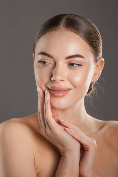 Beautiful Spa Woman Touching her Face stock photo