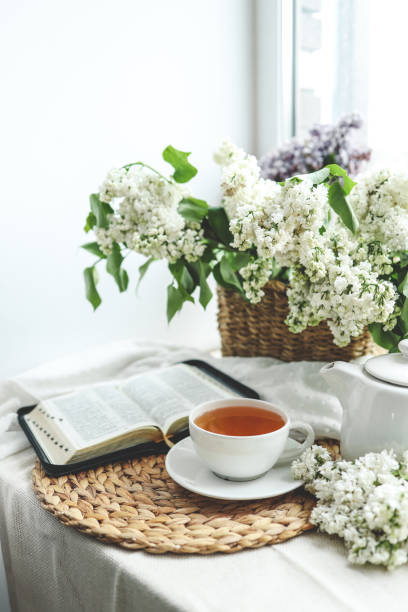 istock Open bible in spring interior, good morning concept 1492377060