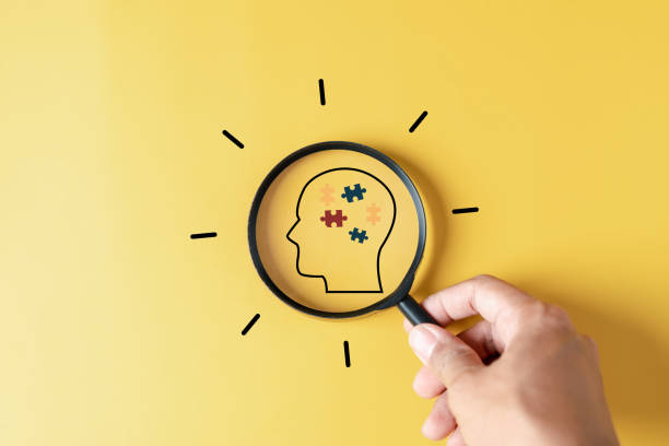 istock Magnifier focus to Human Brain white jigsaw puzzle, mental health, creative thinking, idea , brainstorm and autism awareness concept. 1492377133