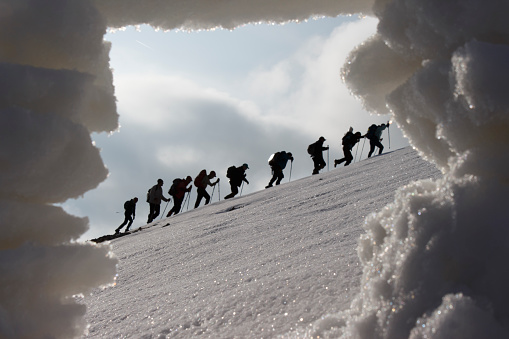 view of people walking in harmony from the snow window