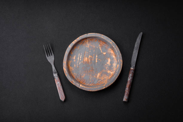 istock Empty wooden plate, knife, fork and cutting board 1492380217