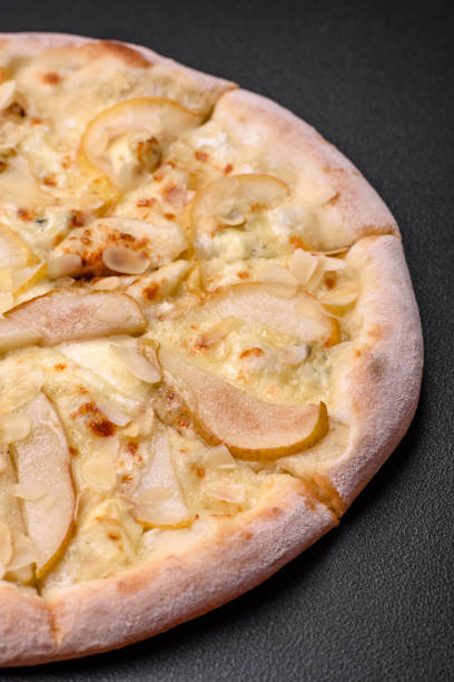 istock Delicious sweet pizza with pear, dorblu cheese and nuts 1492380800