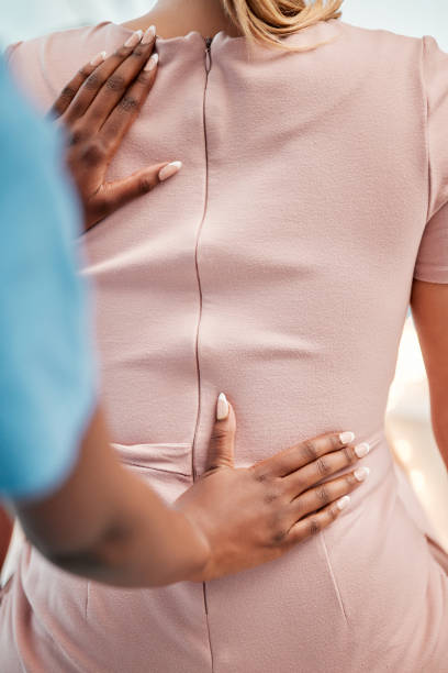 istock Chiropractor, physical therapy and woman with spine, posture and back pain problem with expert for help. Spinal injury, physiotherapy and women in examination, checkup and recovery exam progress 1492383608