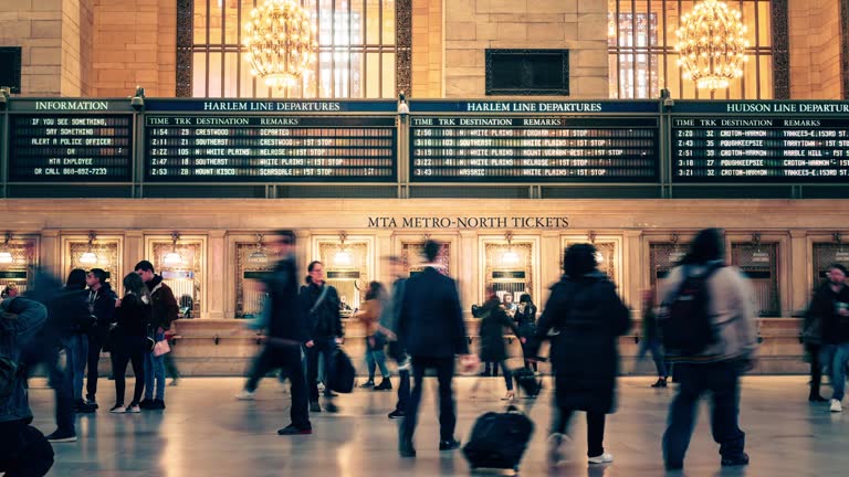 Time lapse Crowd of Passenger and tourist walking and transiting in commuter rail terminal train station in Midtown Manhattan, New York City, United States