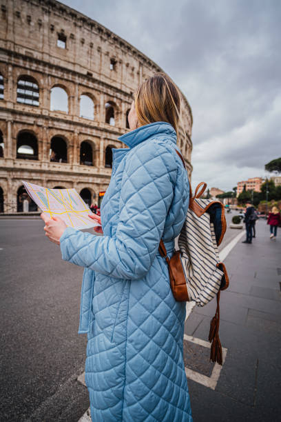 istock Woman tourist using map in Rome, Italy 1492384796