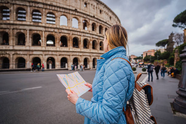 istock Woman tourist using map in Rome, Italy 1492385190