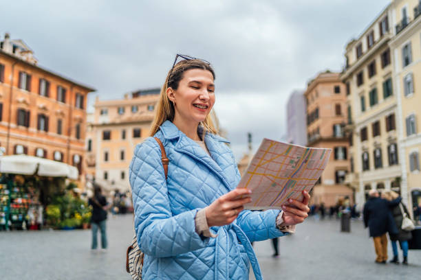 istock Woman tourist using a map on Piazza de Spagna, Rome 1492387427