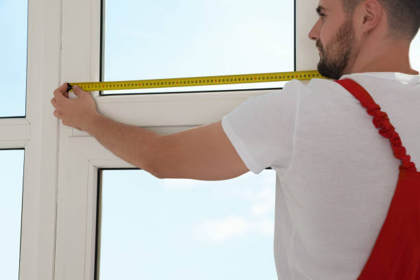 istock Worker measuring window with tape indoors, closeup. Roller blinds installation 1492387865