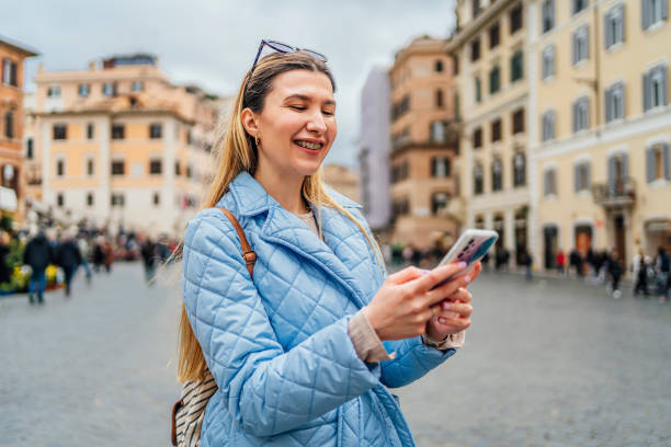 istock Woman using phone on Piazza de Spagna, Rome 1492389560