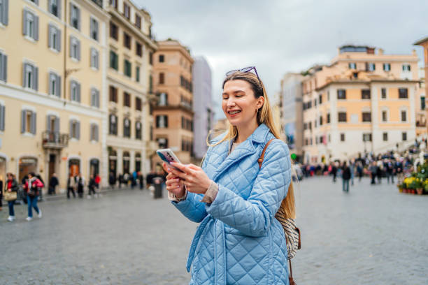 istock Woman using phone on Piazza de Spagna, Rome 1492389630