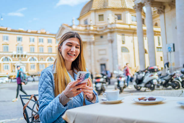 istock Woman drinking coffee on Piazza del Popolo, Rome 1492391243