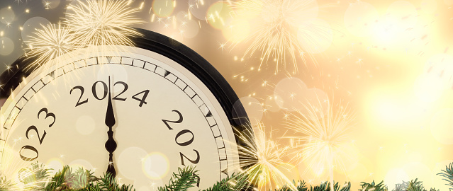 New Year s Eve 2024 concept. Clock hands on year number 2024. Gold magic background with fireworks and blurred lights. Copy space. Christmas and New Years background.