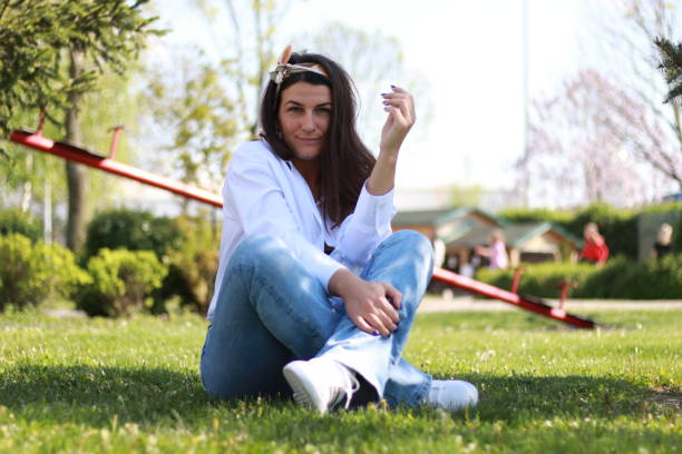 istock Happy relax modern young woman enjoy on grass field 1492392580