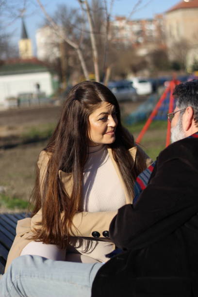 istock Talk of mid-age couple on sunny day 1492393957