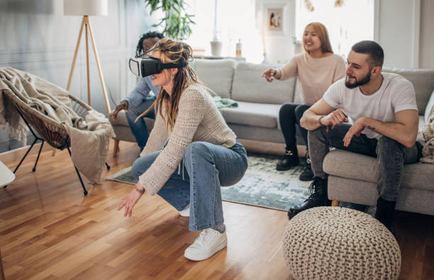 istock Young woman playing VR game 1492396160