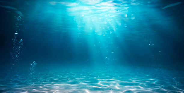 Underwater Blue Abyss With Sunlight stock photo