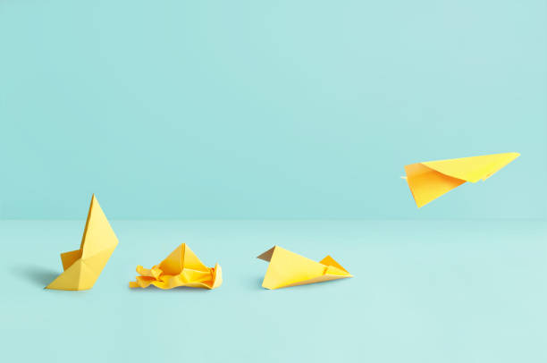 istock Sinking boat to paper airplane success concept 1492397498