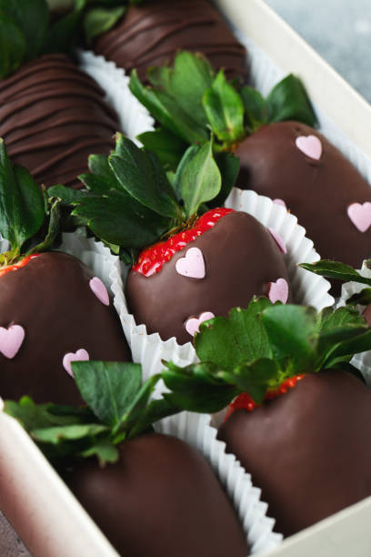 istock Gourmet chocolate covered strawberries on the light background. 1492399569