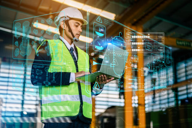 istock Businessmen and male engineers are thinking about methods and working in industrial plants for increased efficiency and safety.He is controlling and planning the operation of the machine by laptop.Engineering concepts and architecture. 1492405164